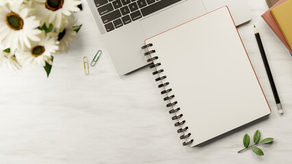 Naklejka premium Top view of blank page notebook on laptop with books and pencil aside flower on marble surface table