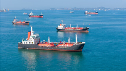 LPG gas and oil tanker ships anchored in the blue ocean. Industrial maritime transport, global...