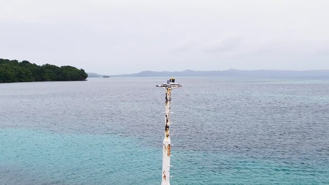 Rusty Navigation Beacon Marker Along the Tropical Coastline of Palau