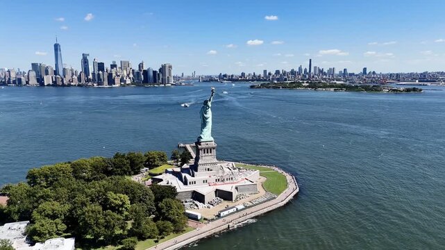 Aerial drone view of Statue of Liberty on Liberty Island with Manhattan skyline and New York Harbor, NYC USA. g.