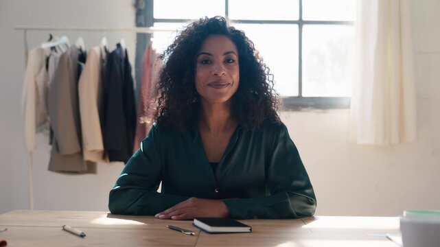 Video of beautiful fashion designer doing a videocall in a coworking place 