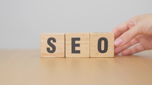 Hand change Wooden block from SEO to SEM. Search Engine Optimization, SEA, Advertising, Marketing, Idea, Strategy, Keyword, Content and technology concept