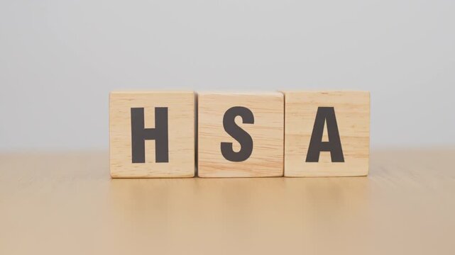 hand change wooden block from FSA to HSA. Flexible Spending Account and Health Savings Account, Medical Expenses, Tax Benefits and healthcare concepts