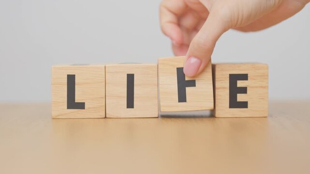hand change wooden block Live to Life. Lifestyle, Live your life, learning, motivation and mindset concepts