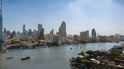 Fototapeta premium Bangkok skyline and business skyscrapers at Chaopraya river, Thailand.