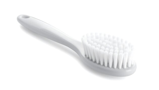 Close-up of a white oval-headed brush against a pristine white backdrop