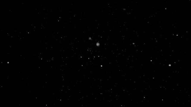 A dark, expansive background filled with numerous tiny, sparkling white dots, resembling a starfield or cosmic dust.
