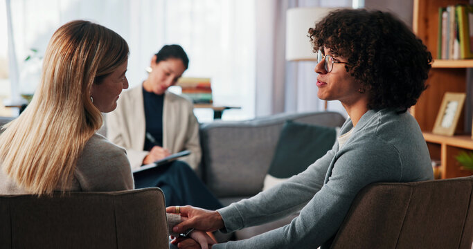 Therapy, holding hands and support with couple in office for healing, love and help. Relationship counseling, psychology solution and marriage partner with man and woman in clinic for advice