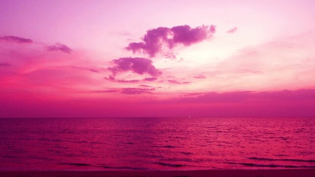 4k Magenta purple sunset beach n Gradient Pastel pink sky background with dramatic dark rain storm clouds n wispy smoke cloudscape over calm ocean wave n sea water in tropical summer sunlight sun ray