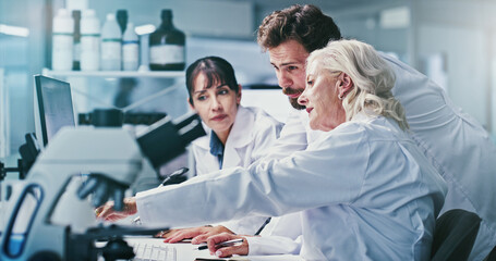 Science, people and discussion in lab with computer, manager advice and experiment for medical research. Scientist, team and review test results in clinic with pc, collaboration and healthcare study. © peopleimages.com