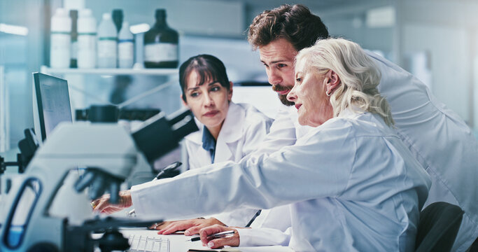 Science, people and discussion in lab with computer, manager advice and experiment for medical research. Scientist, team and review test results in clinic with pc, collaboration and healthcare study.