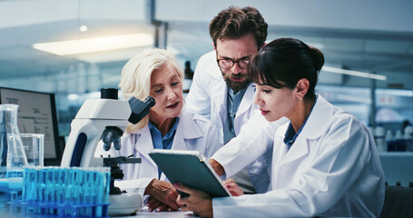 Fototapeta premium People, scientist and team with tablet at lab for discussion, medical research and review for virus cure. Group, tech and checklist for progress report on app, feedback and pharma study for vaccine