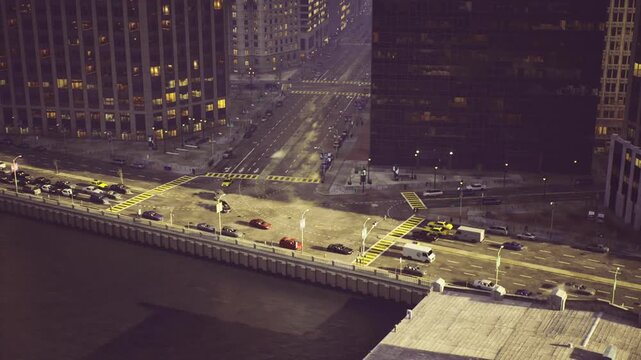 Aerial miami intersection showing crosswalks and roadway markings, strong geometric lines and waterfront edge, useful for urban design, planning and editorial