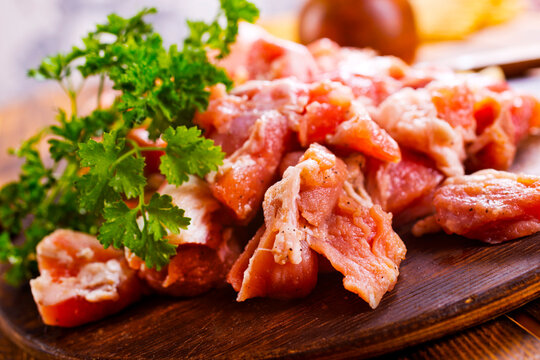 raw meat with spice on wooden board