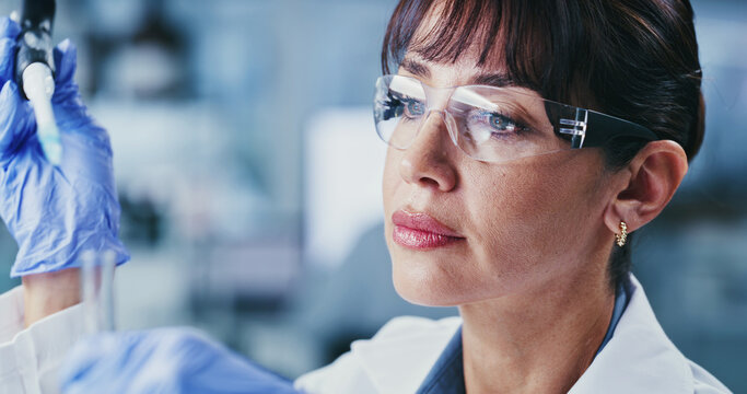 Scientist, woman and pipette in lab with test tube, DNA experiment or evaluation for medical research. Mature person, science or sample review in clinic with equipment, healthcare trial or innovation