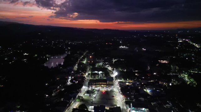 Warm sunset light fading into evening as town lights begin appearing across the landscape of Maragondon Cavite Philippines.