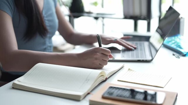 Asian Female University Student Studying Online on Laptop