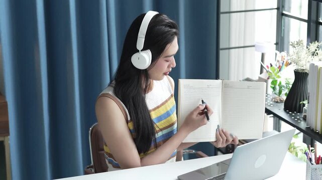 Asian Female University Student Studying Online on Laptop
