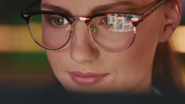 Business, glasses and happy woman scroll on computer for media, research or website at night. Closeup, reading specs and professional person with technology for homepage design deadline in office