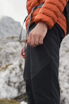 Detail of a hiker's waterproof trousers and gear