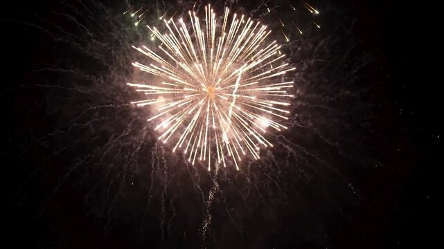 explosion of gold firework bursting outwards from the center against a dark, deep space background