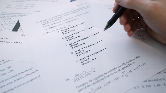 Close-Up of Student Hand Completing Multiple Choice Exam Paper, Filling Answers on Standardized School Test, Education Assessment Concept. IQ test