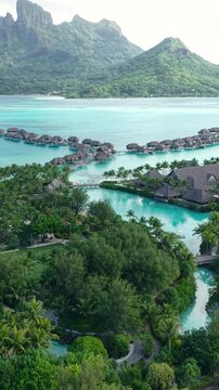 Bora Bora Island, French Polynesia. Vertical Drone Shot of Luxury Resort With View of Lagoon and Main Island