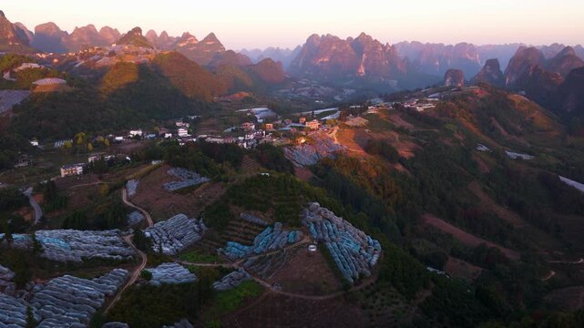 Agriculture Land With Plastic-film Mulch To Protect Crops Overlooking Karst Mountain Landscape In Yangshuo County, Guangxi Province, China. Aerial Drone Shot