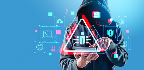 A hooded person using a tablet with glowing cybersecurity icons and warning symbols in a modern...