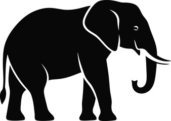 Fototapeta premium A black silhouette of an elephant standing with its trunk curled