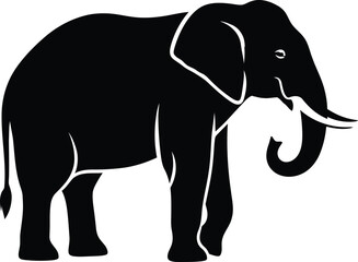 Fototapeta premium A black silhouette of an elephant standing with its trunk curled