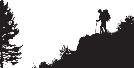 Obraz premium Silhouette of a hiker with a backpack standing on a rocky outcrop