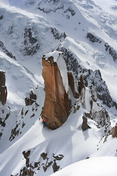 Dramatic vertical rock face with snow in the high Alps