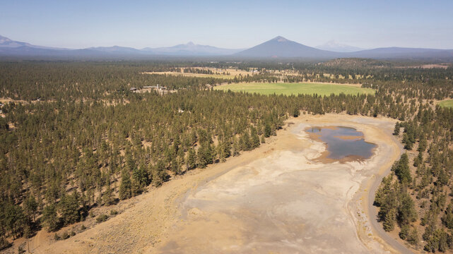 Dry reservoir aerial image in American West during severe drought.