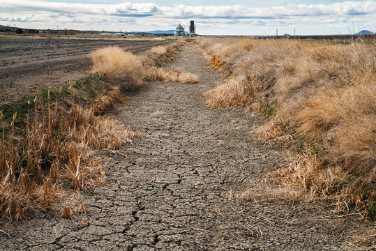 A dry irrigation canal in the arid American West.