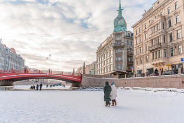 Obraz premium People walk along the canals on ice in winter in the center of the city. Saint Petersburg, Russia - 2 Feb 2026