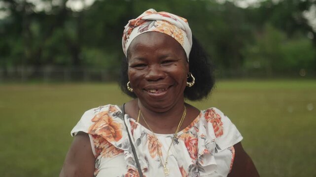 Smiling Garifuna Woman in Traditional Dress Outdoors in Honduras, Authentic Cultural Heritage