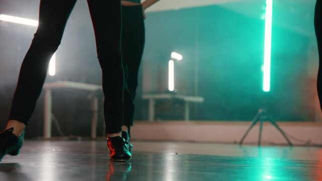 Young talented girls tap dancing routine in a modern dance studio