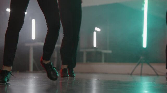 Young talented girls tap dancing routine in a modern dance studio