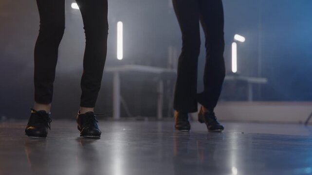 Young talented girls tap dancing routine in a modern dance studio
