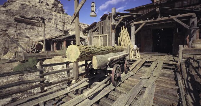 Rustic wooden cart filled with logs rests on a weathered wooden platform near an old building surrounded by rocky terrain and towering cliffs under a clear blue sky.