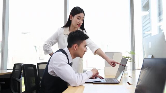 Serious Stern Superior Reprimands Remorseful Subordinate in Tense Office, boss scolding her employee, dissatisfied with his employees work, strict business rules in a modern office setting