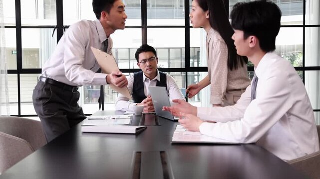 Frustrated colleagues having a heated discussion about marketing data, a stressful office environment with stressful argument while discussing unsatisfactory work performance over a project meeting
