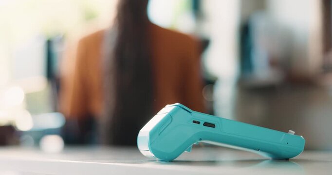 Woman, barista and cafe with pos machine for checkout, payment system or customer service. Female person, waitress or counter with electronic point of sale scanner for NFC or cashless coffee shop