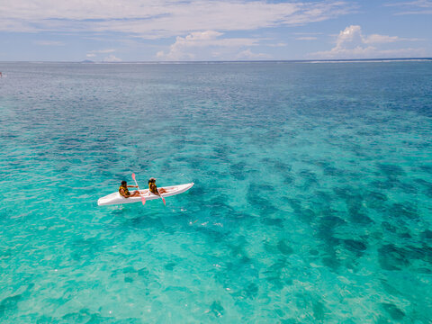 Kayaking adventure in tranquil turquoise waters of Flacq, Mauritius under clear blue skies