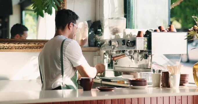 Barista, man and steam milk with coffee machine for customer service, make latte and hospitality. Worker, caffeine or heat dairy in cafe for drink, beverage preparation and process with cream