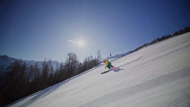 High performance alpine ski carving on groomed pistes in Verbier Bruson and Val de Bagnes filmed with drone and follow cam on a bluebird winter day showcasing fast dynamic fun skiing.