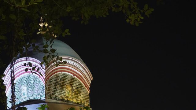 Close-up view of Kalighat Kali Temple at night with glowing lights, capturing spiritual atmosphere and powerful presence of Maa Kali.