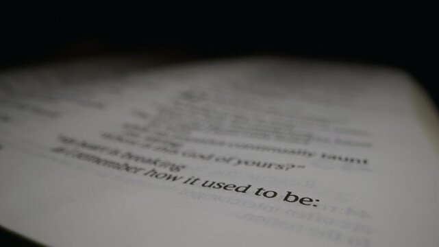 A detailed view of text a Bible, focusing on specific passages.