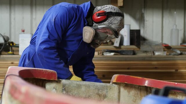 Sanding fiberglass boat transom using orbital sander